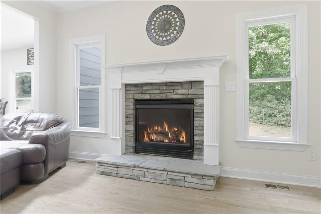 67 Pointer Lane Braselton, GA 30517 - Photo 23 of 74 a living room with furniture and a fireplace