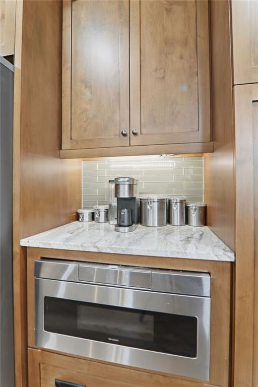 67 Pointer Lane Braselton, GA 30517 - Photo 27 of 74 a stove top oven sitting inside of a kitchen