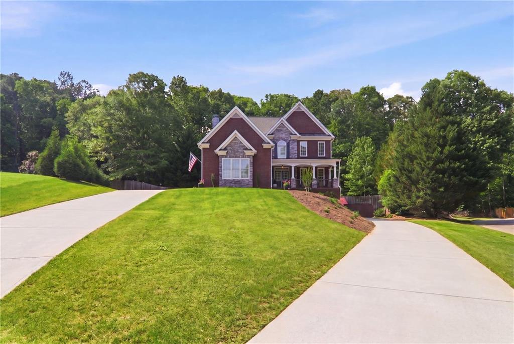 67 Pointer Lane Braselton, GA 30517 - Photo 3 of 74 a front view of a house with yard