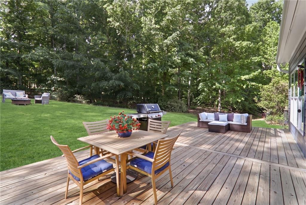 67 Pointer Lane Braselton, GA 30517 - Photo 37 of 74 a view of a chairs and table on the wooden deck
