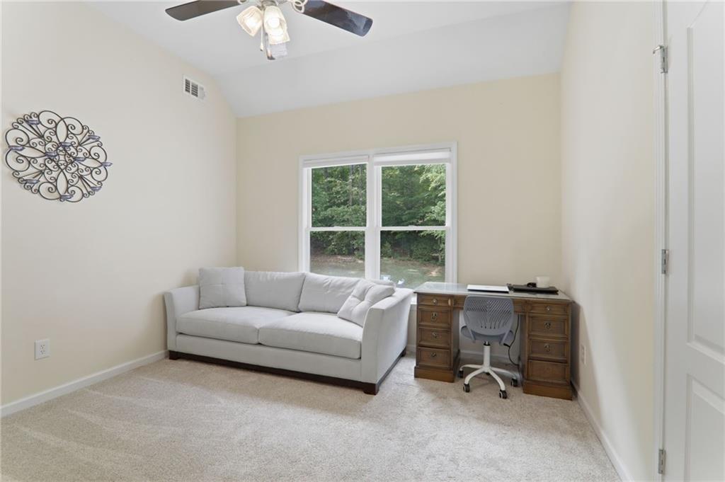 67 Pointer Lane Braselton, GA 30517 - Photo 48 of 74 a living room with furniture and a window