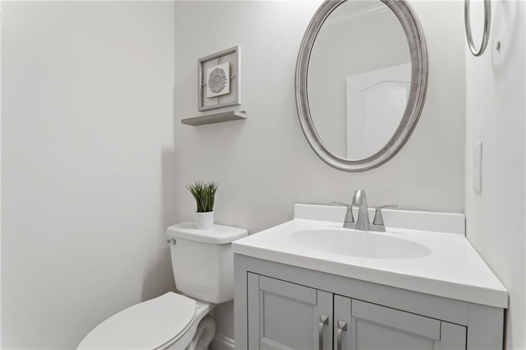 67 Pointer Lane Braselton, GA 30517 - Photo 49 of 74 a bathroom with a sink a toilet and a mirror