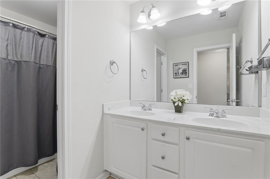 67 Pointer Lane Braselton, GA 30517 - Photo 52 of 74 a bathroom with a sink vanity granite and a mirror