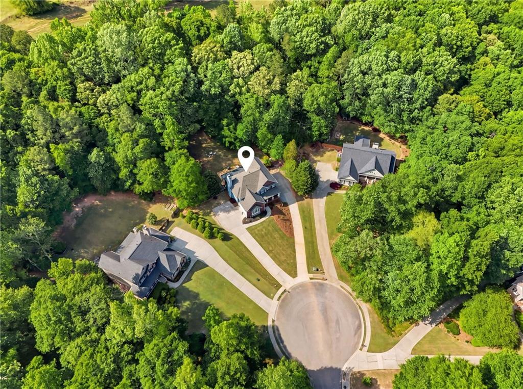 67 Pointer Lane Braselton, GA 30517 - Photo 69 of 74 an aerial view of a house with a swimming pool and garden
