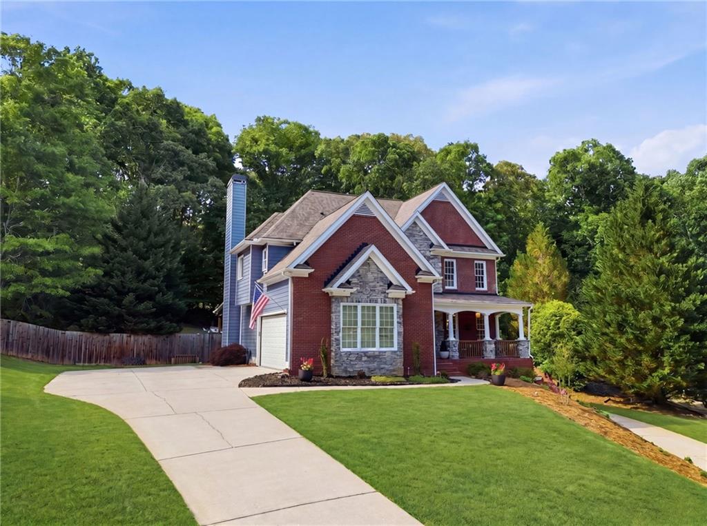 67 Pointer Lane Braselton, GA 30517 - Photo 10 of 74 a front view of a house with a yard