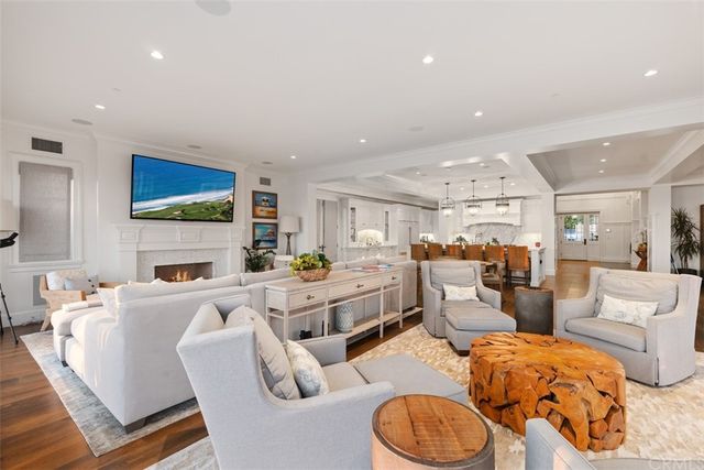 a kitchen with stainless steel appliances a sink a counter top space cabinets and a potted plant