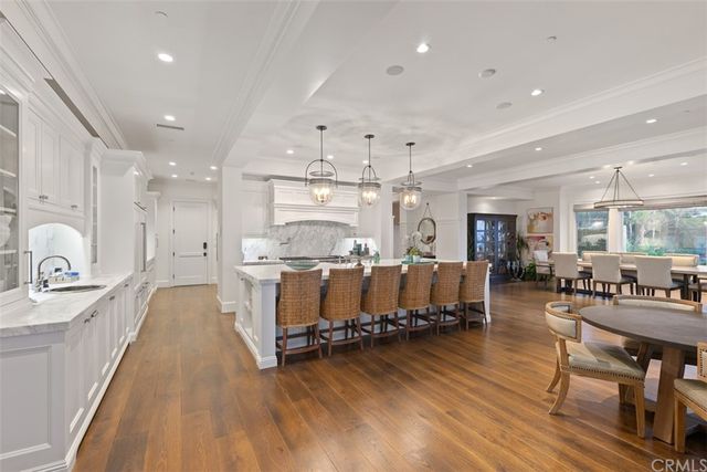 a living room with furniture a fireplace and a large window