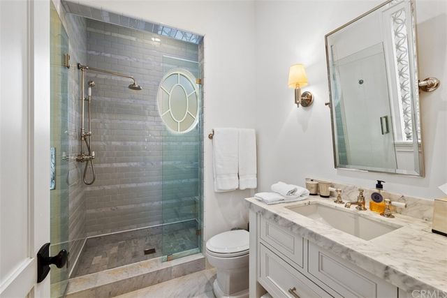 a view of roof deck with couches and city view