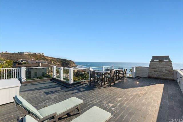 a view of swimming pool with outdoor seating