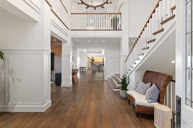 a living room with furniture fireplace and large window