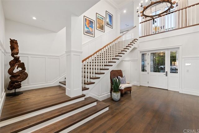 a living room with fireplace furniture and a large window