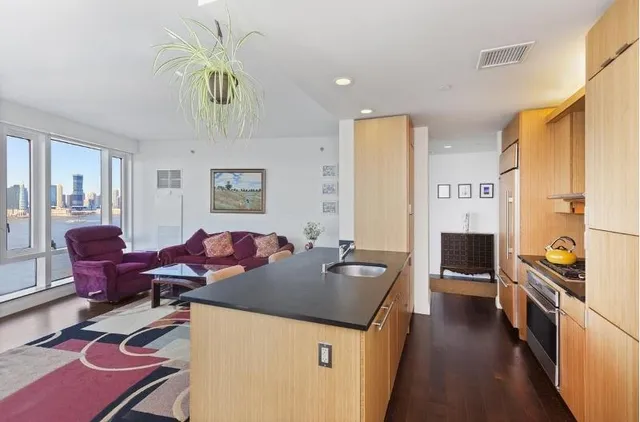 a view of a ocean with tall buildings