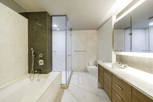 a bedroom with bed and window