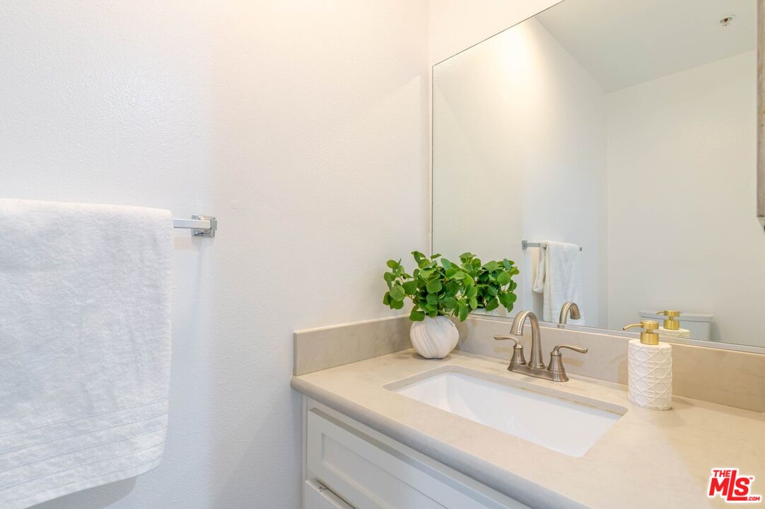 5521 Kester Avenue, Unit 7 Sherman Oaks, CA 91411 - Photo 12 of 45 a bathroom with a sink and a mirror