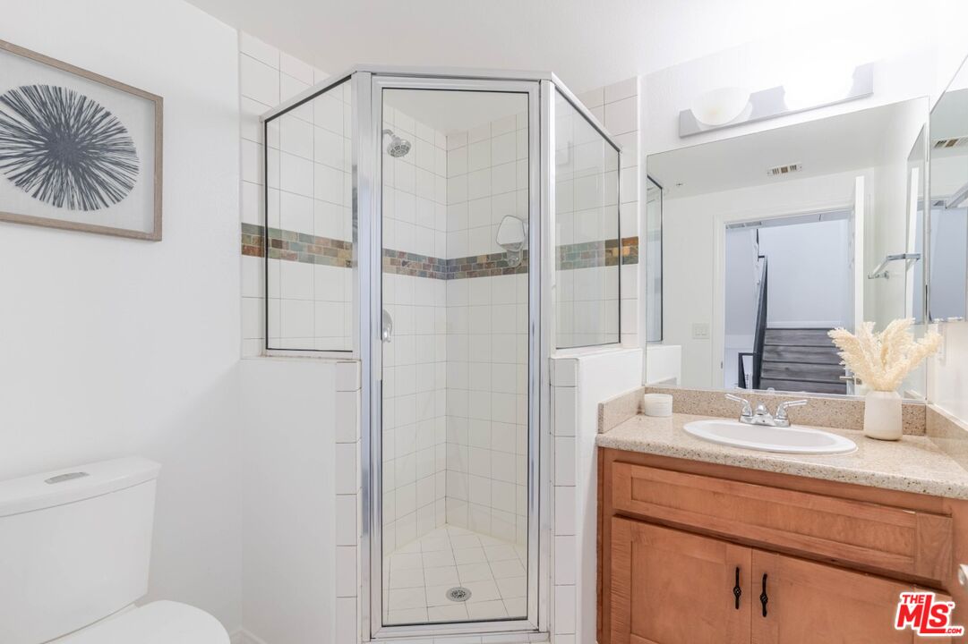 5521 Kester Avenue, Unit 7 Sherman Oaks, CA 91411 - Photo 21 of 45 a bathroom with a sink and a mirror