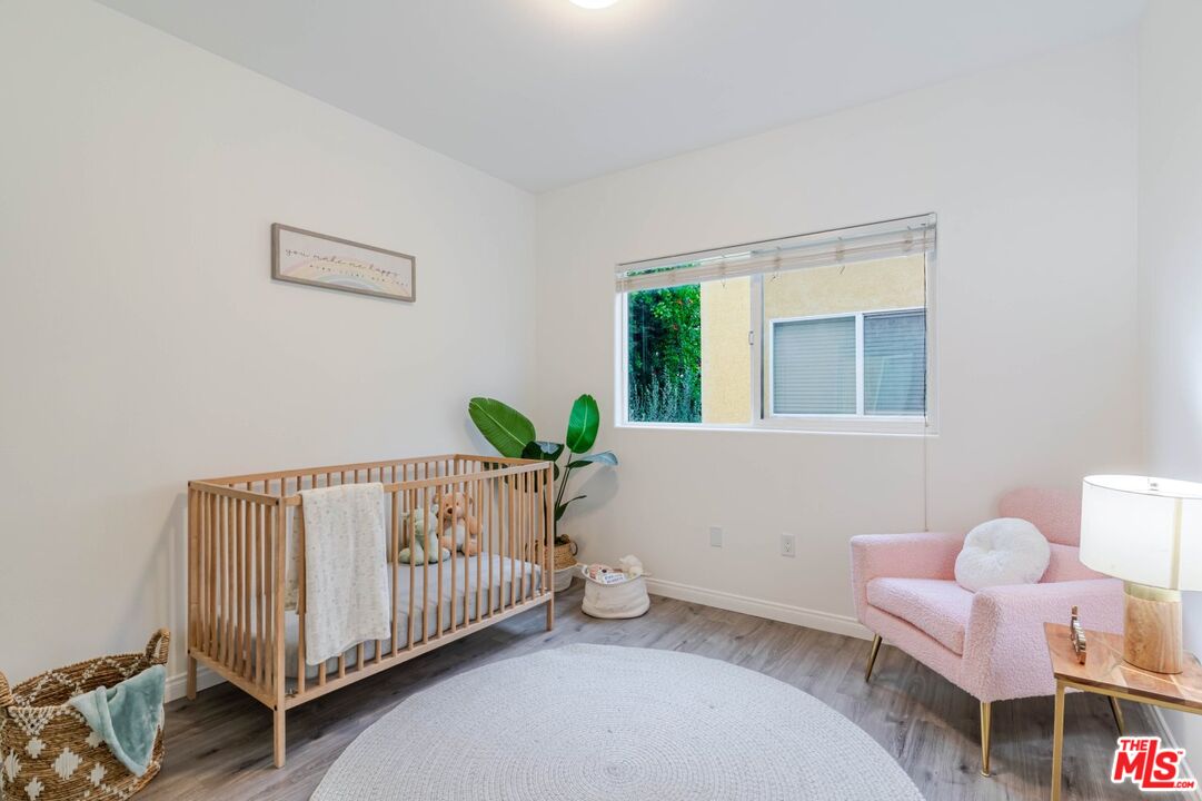 5521 Kester Avenue, Unit 7 Sherman Oaks, CA 91411 - Photo 22 of 45 a bed room with furniture and a window