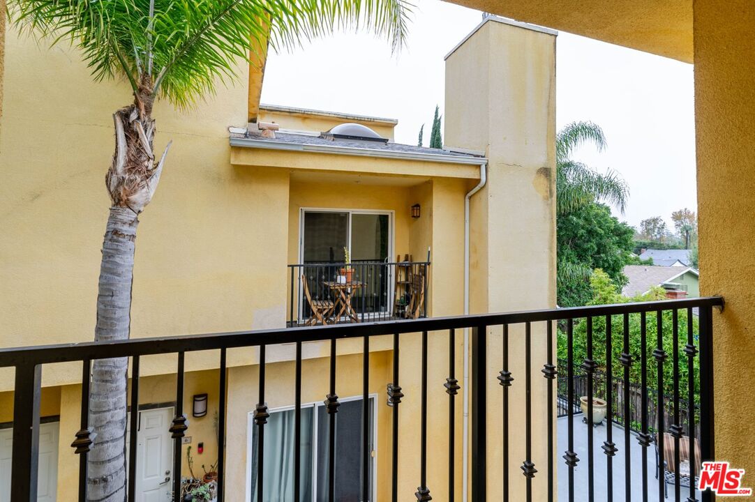5521 Kester Avenue, Unit 7 Sherman Oaks, CA 91411 - Photo 32 of 45 a view of a balcony with a palm tree