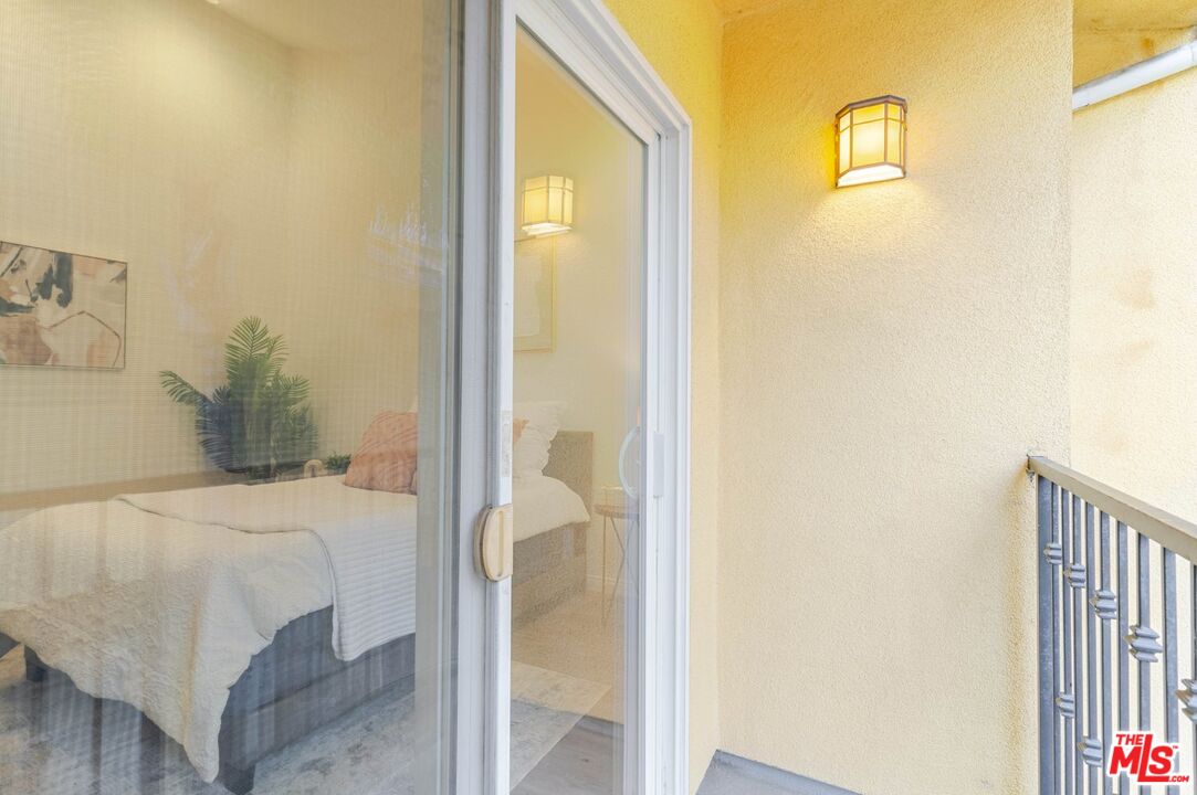 5521 Kester Avenue, Unit 7 Sherman Oaks, CA 91411 - Photo 33 of 45 a bedroom with a bed and a table