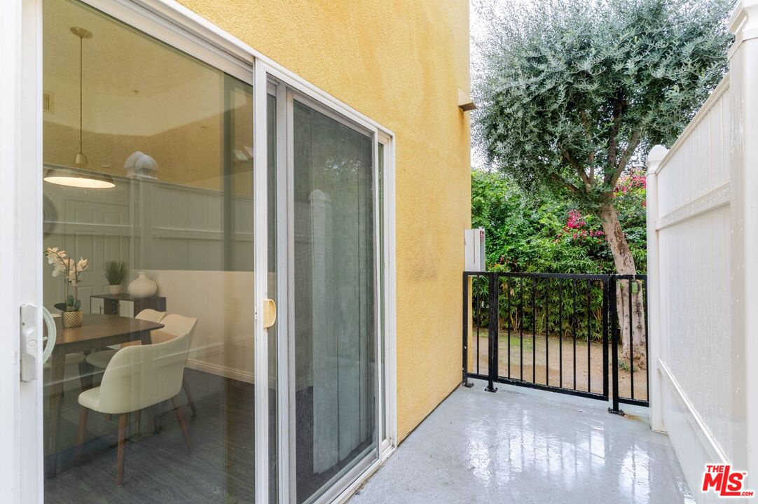 5521 Kester Avenue, Unit 7 Sherman Oaks, CA 91411 - Photo 38 of 45 a view of a balcony with chair and potted plants