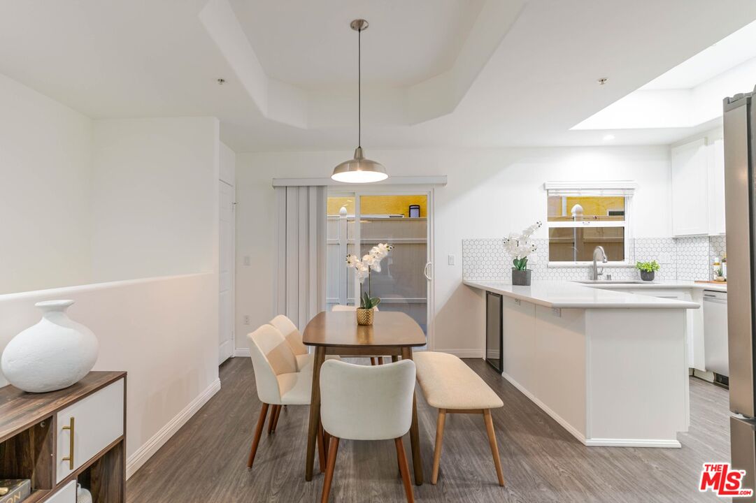 5521 Kester Avenue, Unit 7 Sherman Oaks, CA 91411 - Photo 6 of 45 a dining room with furniture and window