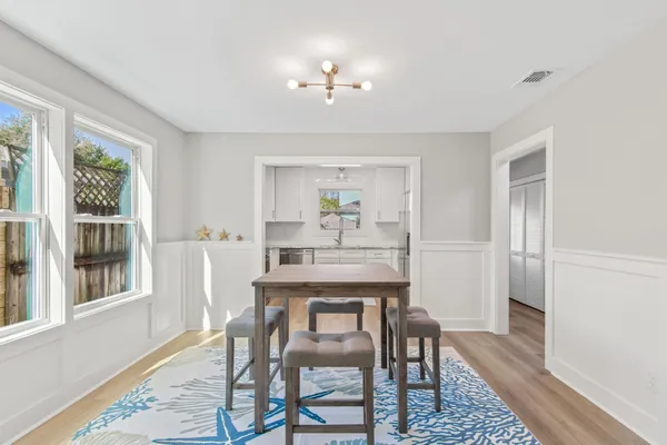 a dining room with furniture and window