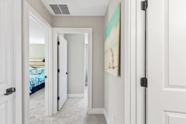 a bedroom with a bed dresser and a window