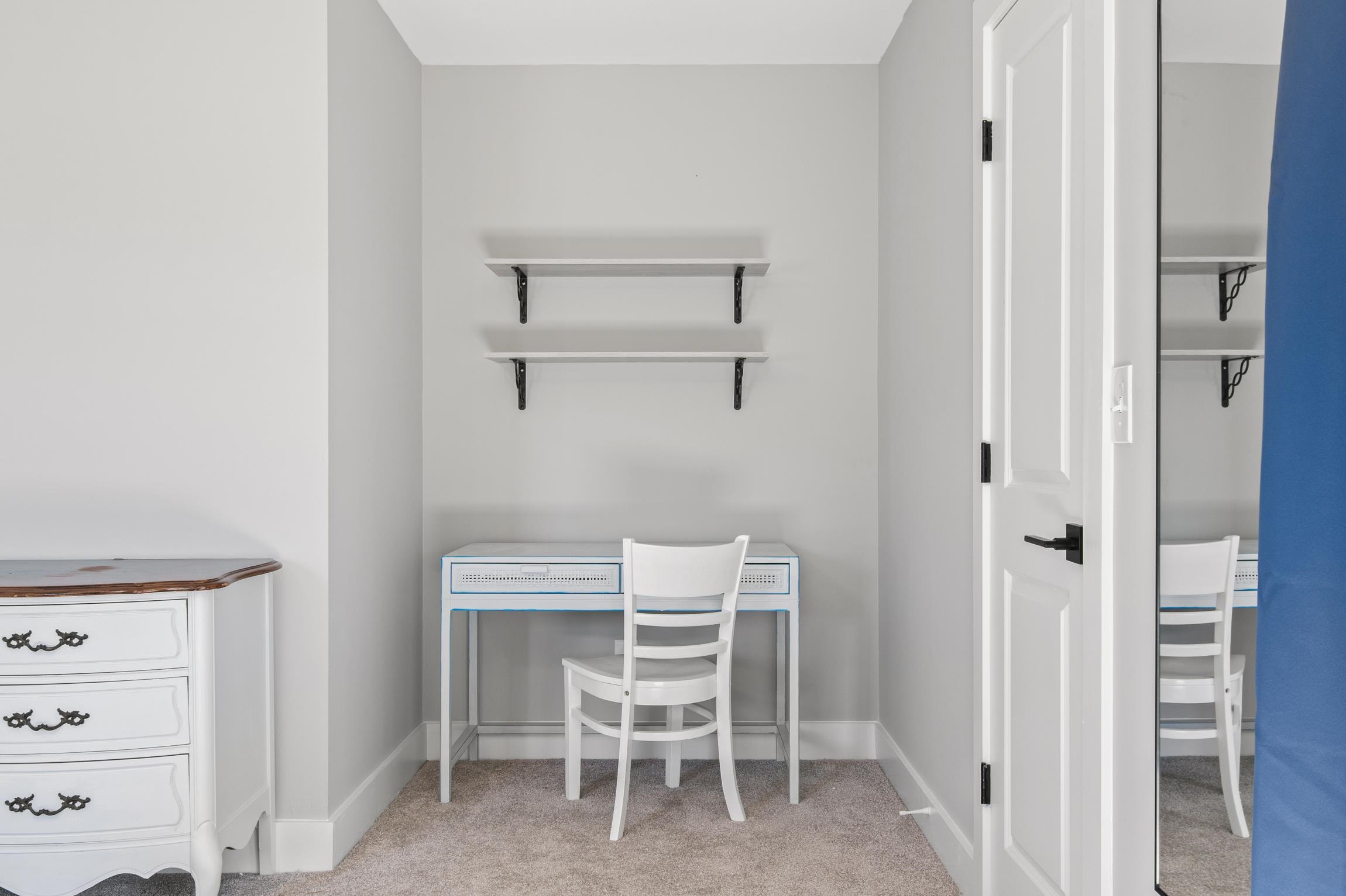 112 2nd Street, Unit A St. Augustine, FL 32080 - Photo 22 of 48 a chair and a table in a room