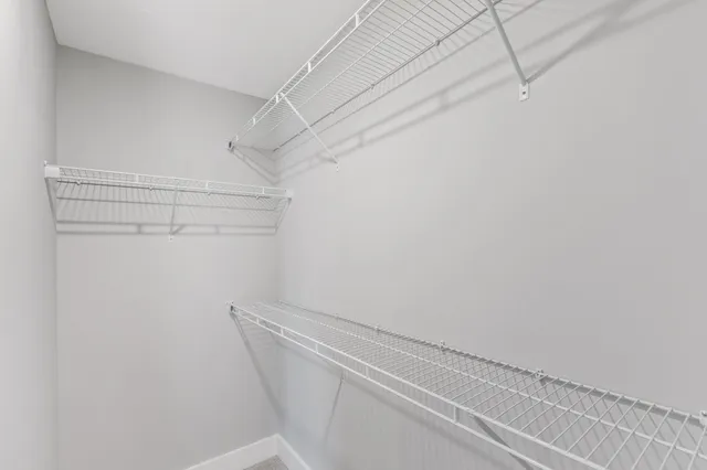 a view of balcony with wooden floor and fence