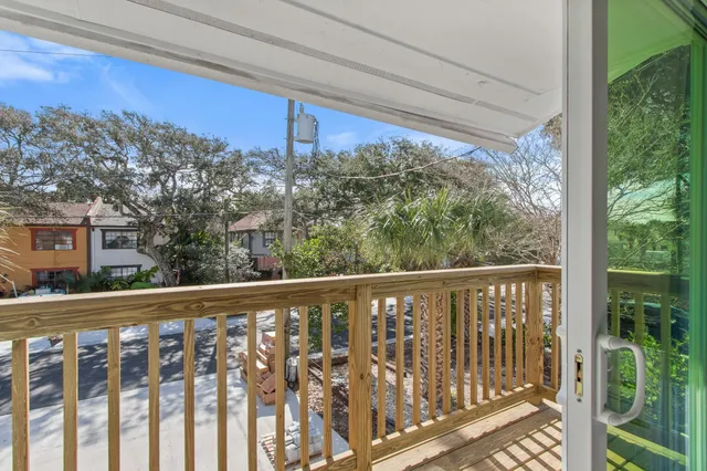 a bedroom with two beds and a window