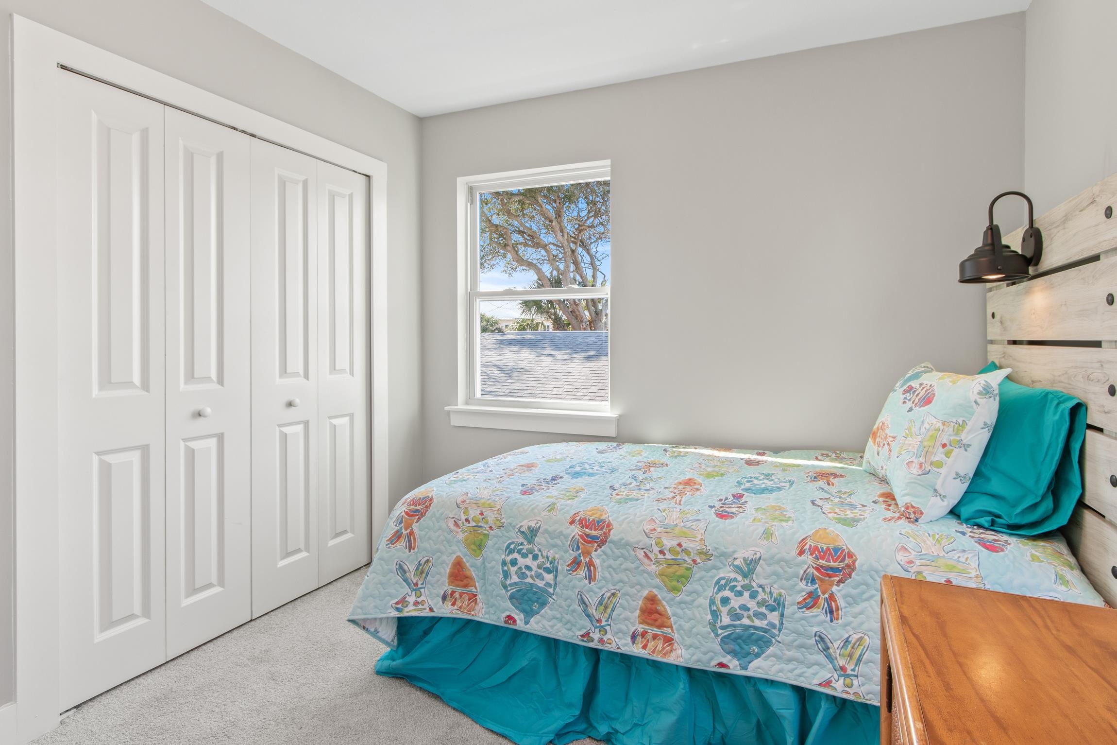 112 2nd Street, Unit A St. Augustine, FL 32080 - Photo 27 of 48 a bedroom with a bed and a window