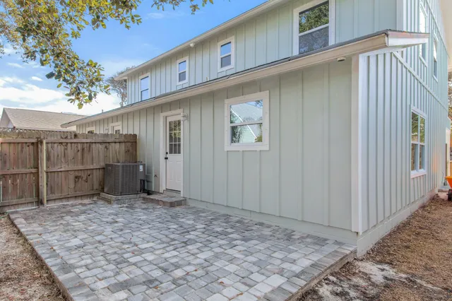 a view of a backyard with large trees