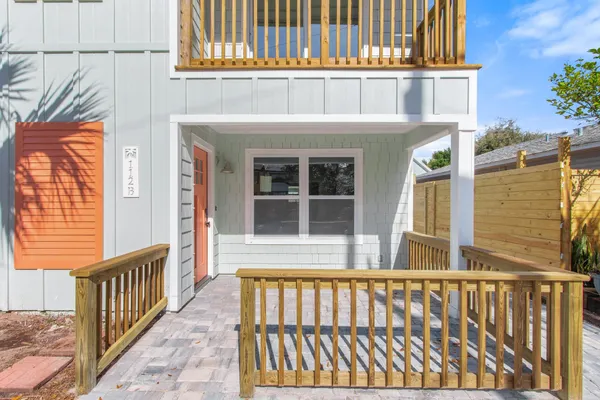 a view of a brick house with a large window