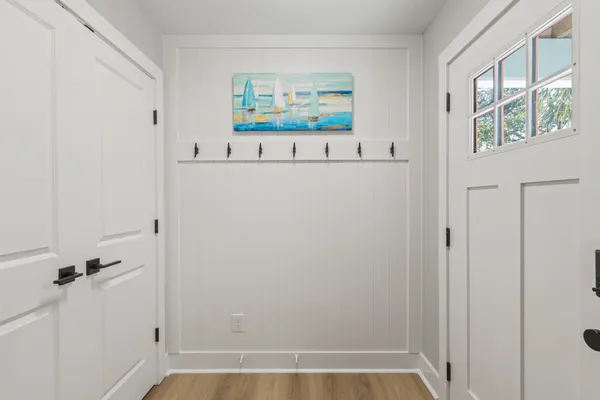 a view of a hallway with paintings on the wall