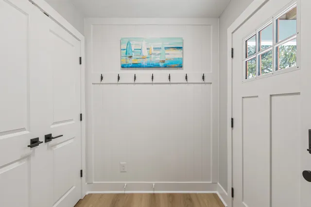 a view of a hallway with paintings on the wall