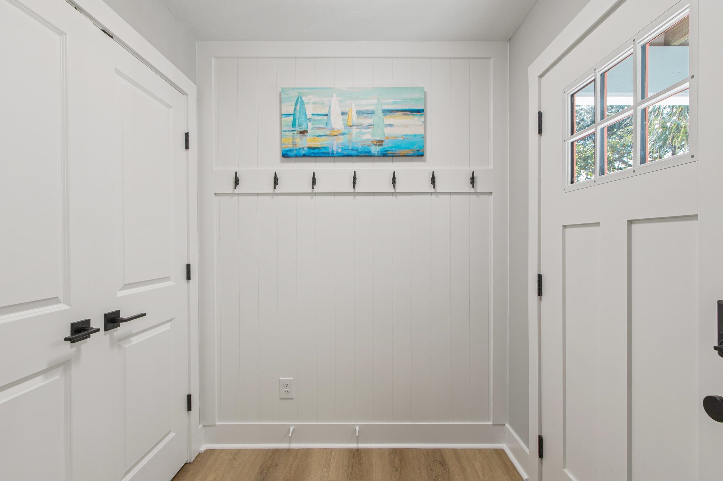 112 2nd Street, Unit A St. Augustine, FL 32080 - Photo 6 of 48 a view of a hallway with paintings on the wall