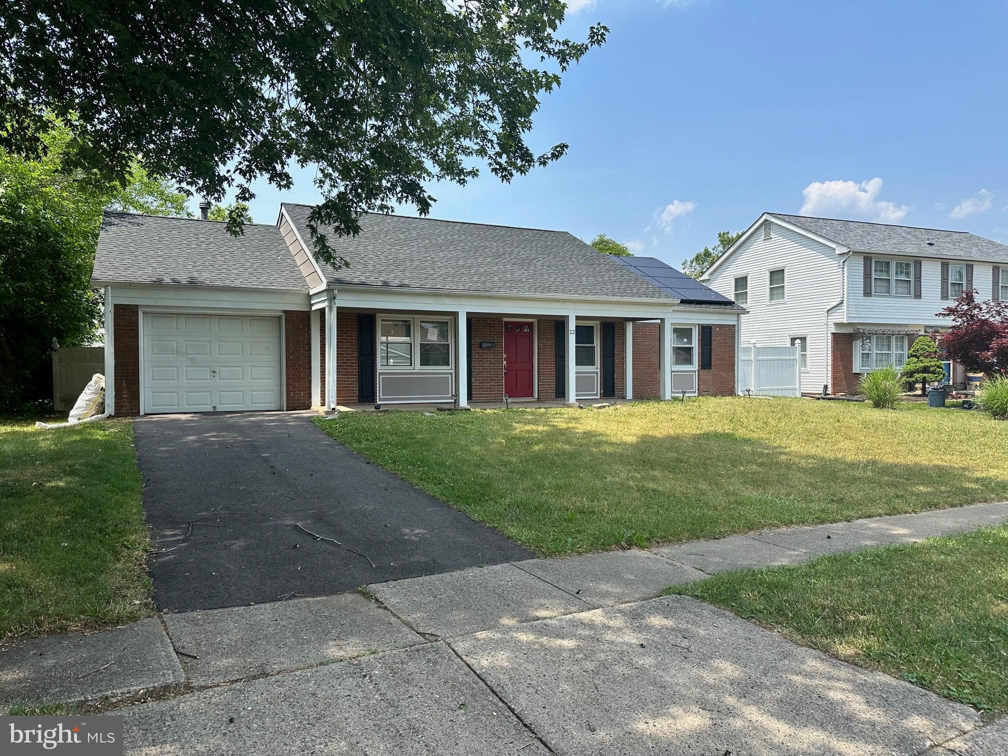 22 Gaylord Circle Willingboro, NJ 08046 - Photo 16 of 17 a front view of a house with a garden