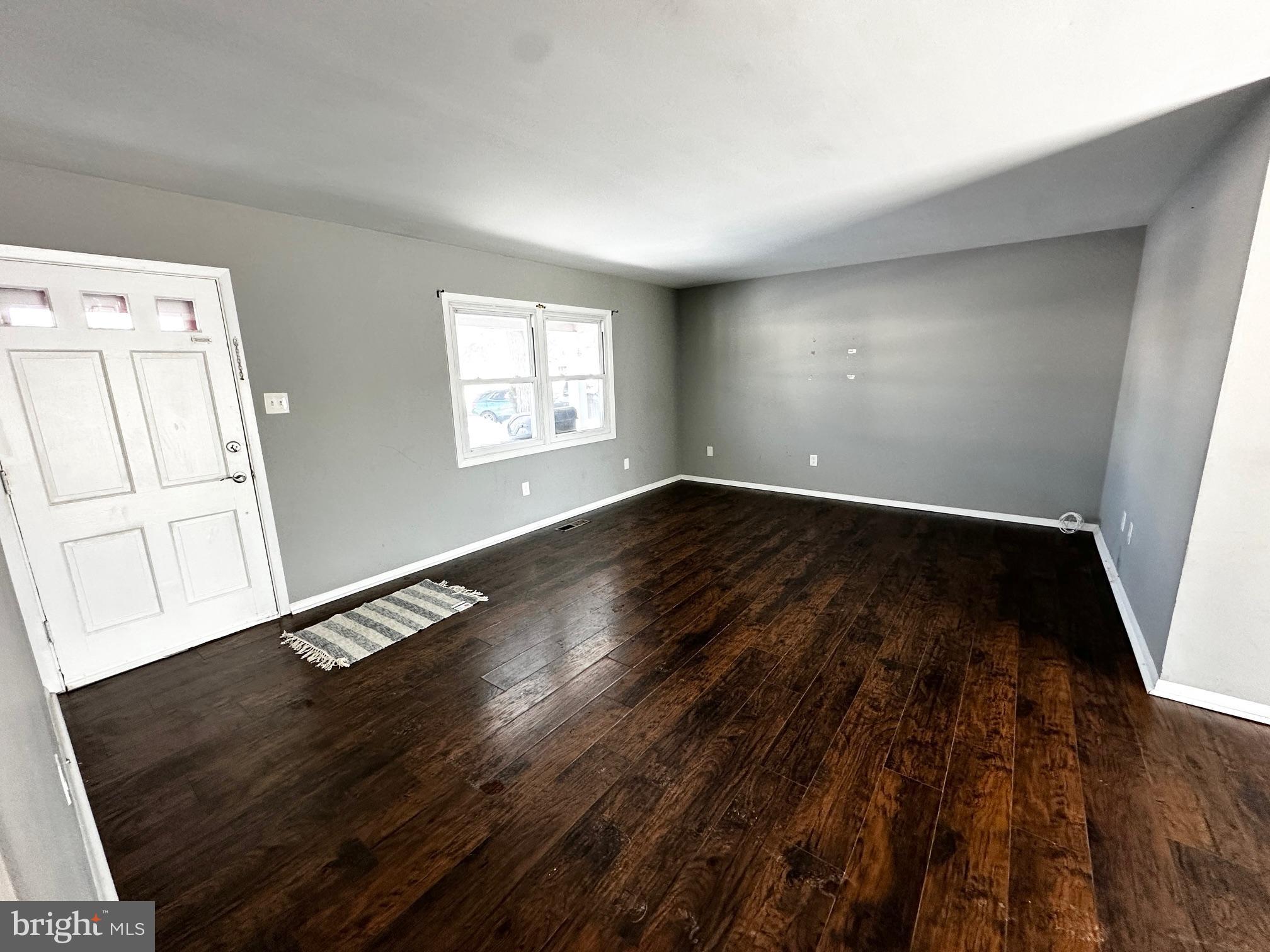 22 Gaylord Circle Willingboro, NJ 08046 - Photo 2 of 17 an empty room with wooden floor and windows