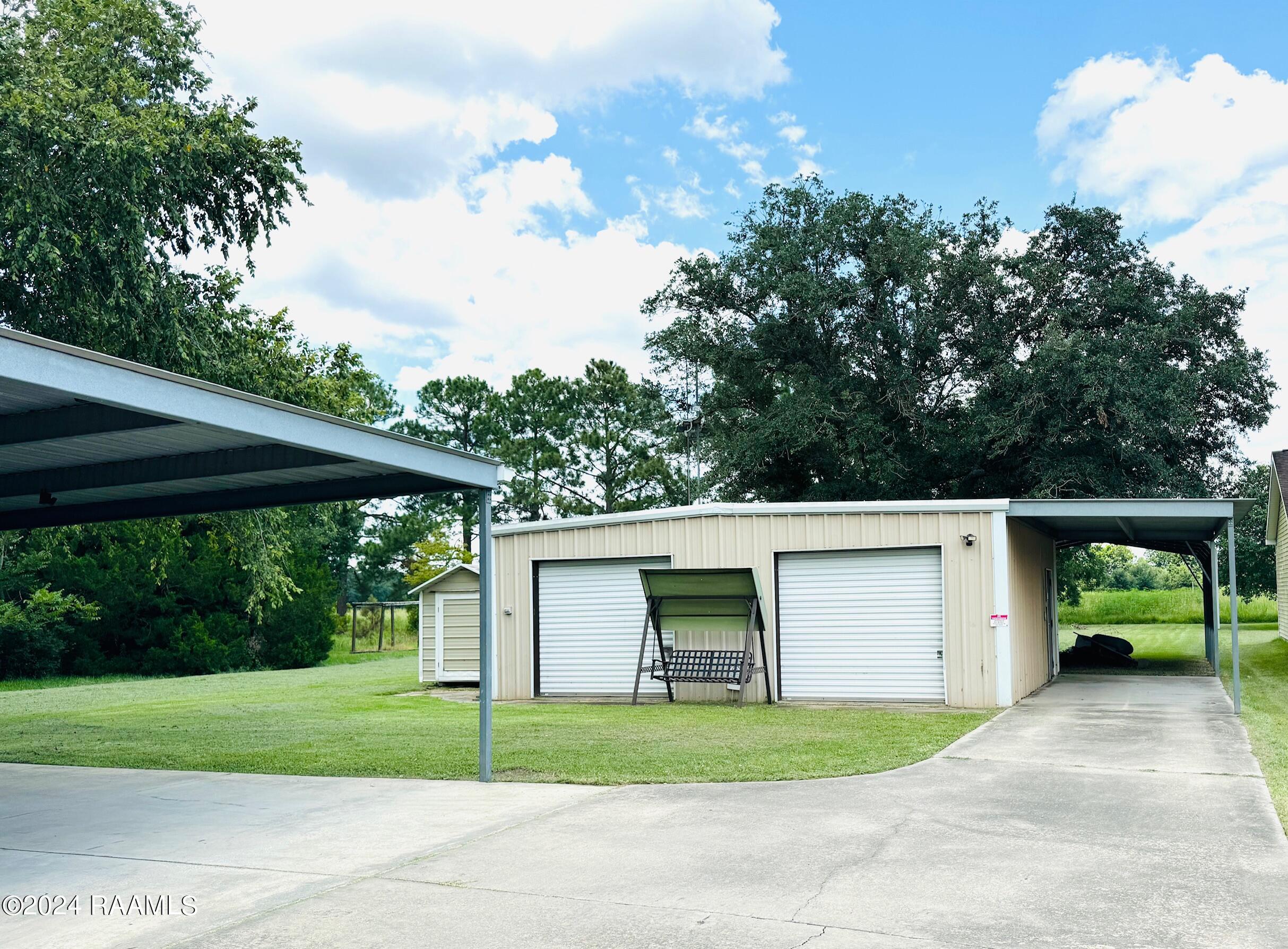 1214 Breaux Road Lafayette, LA 70506 - Photo 2 of 19 Driveway to Shop area