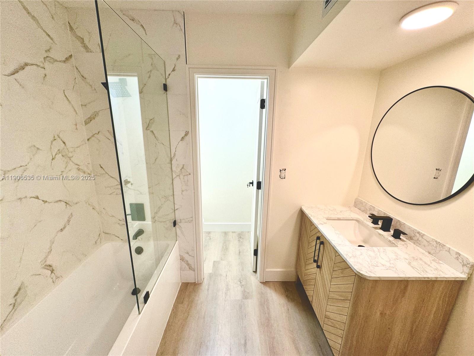 16401 Bridge End Road, Unit 16401 Miami Lakes, FL 33014 - Photo 13 of 19 a bathroom with a sink a toilet and shower