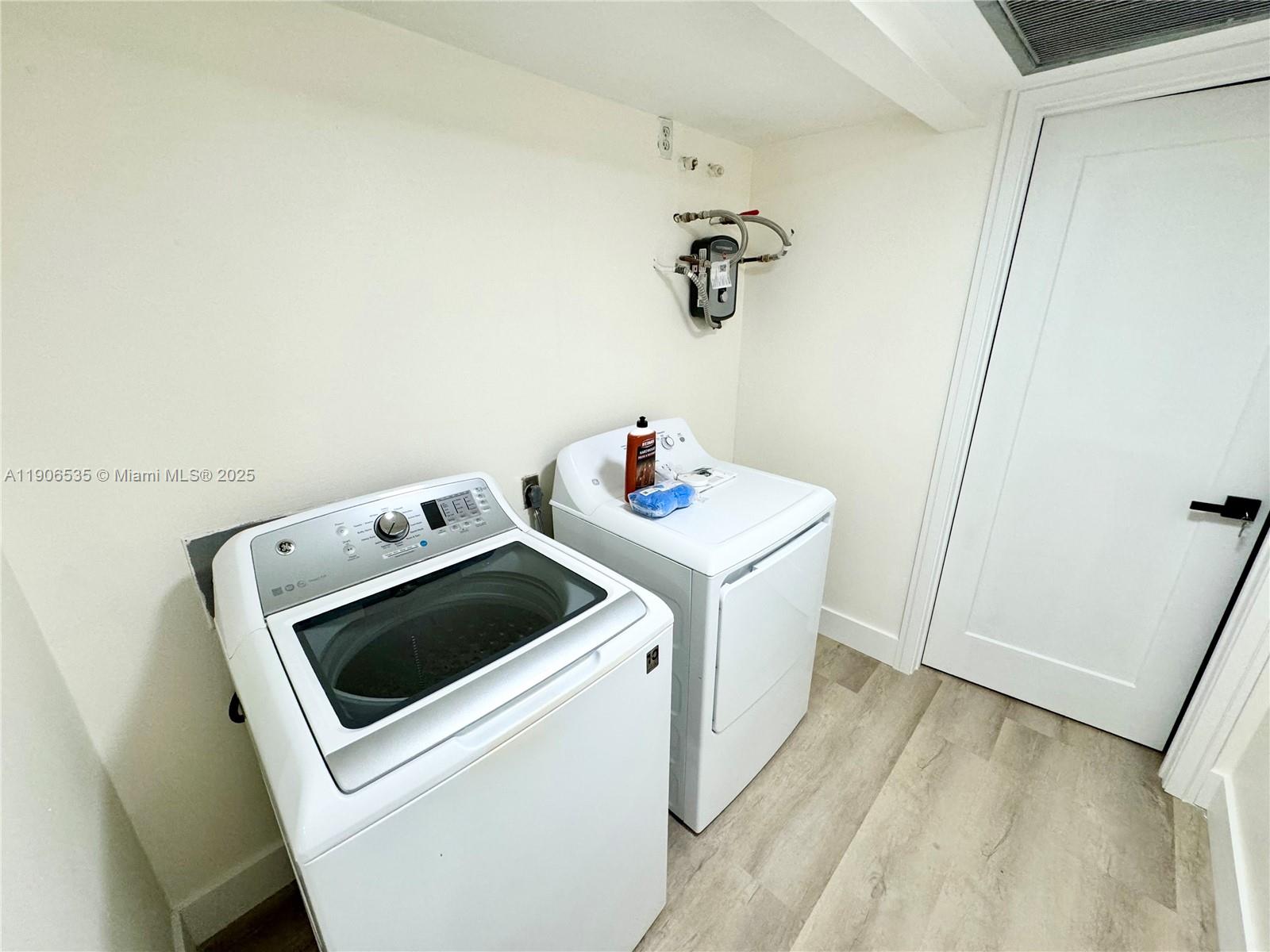 16401 Bridge End Road, Unit 16401 Miami Lakes, FL 33014 - Photo 16 of 19 a utility room with dryer and washer