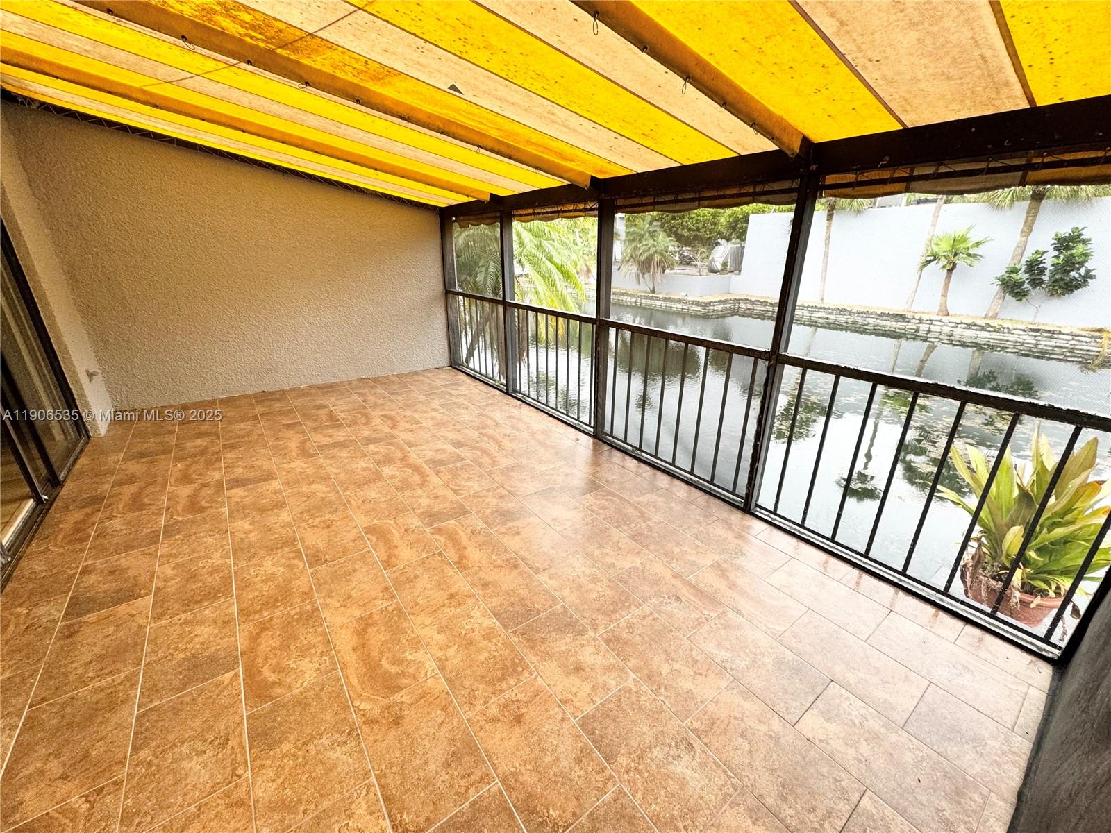 16401 Bridge End Road, Unit 16401 Miami Lakes, FL 33014 - Photo 18 of 19 a view of a porch