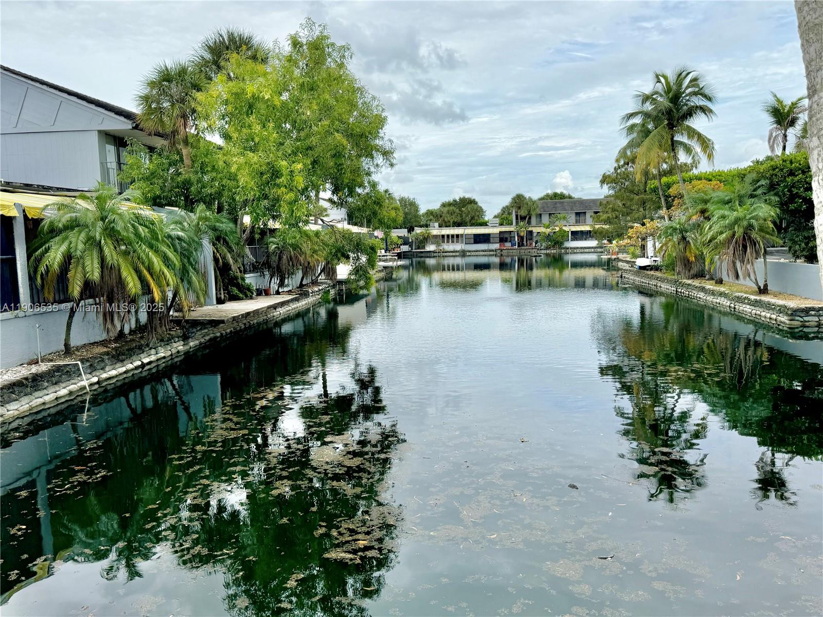 16401 Bridge End Road, Unit 16401 Miami Lakes, FL 33014 - Photo 19 of 19 a view of a lake with a house