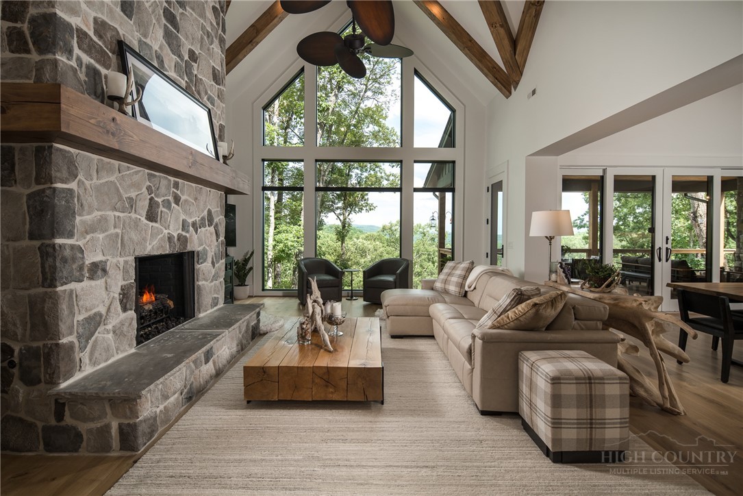 1236 Ninebark Road Boone, NC 28607 - Photo 2 of 50 a living room with furniture large window and a fireplace