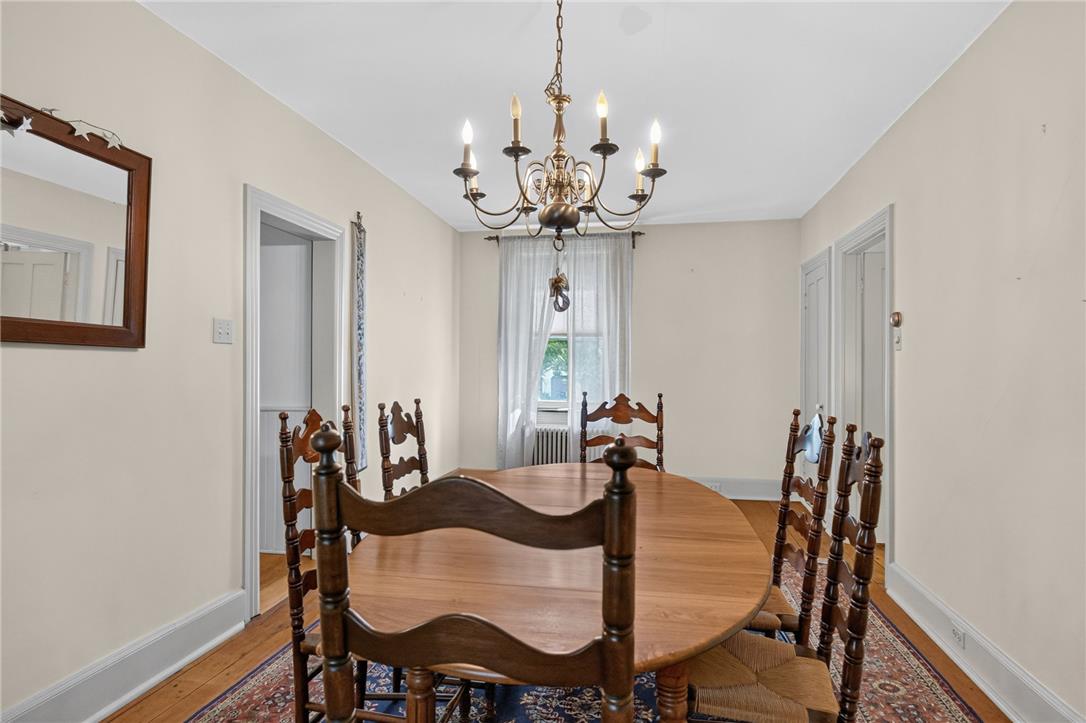765 East Macada Road Bethlehem, PA 18017 - Photo 13 of 46 A classic dining room illuminated by a charming chandelier, perfect for intimate gatherings.