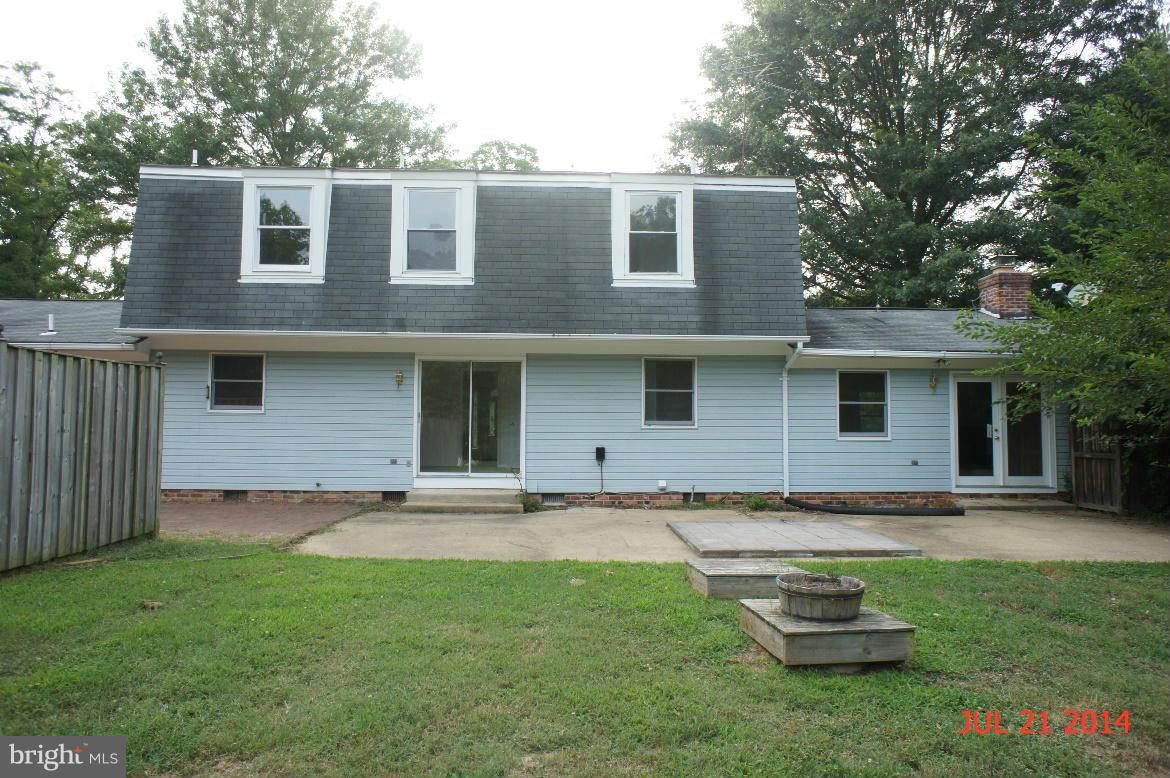 1821 Hatfield Road Huntingtown, MD 20639 - Photo 2 of 18 a front view of a house with a garden