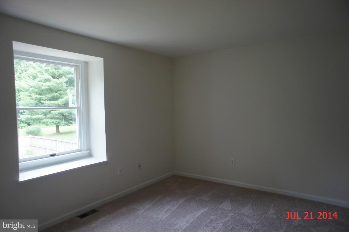 1821 Hatfield Road Huntingtown, MD 20639 - Photo 14 of 18 an empty room with a window