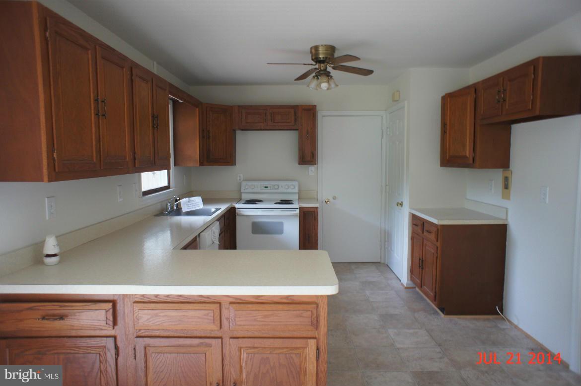 1821 Hatfield Road Huntingtown, MD 20639 - Photo 4 of 18 a kitchen with a cabinets and appliances