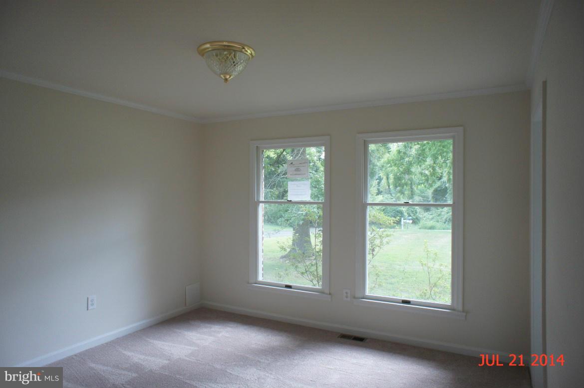 1821 Hatfield Road Huntingtown, MD 20639 - Photo 5 of 18 an empty room with windows