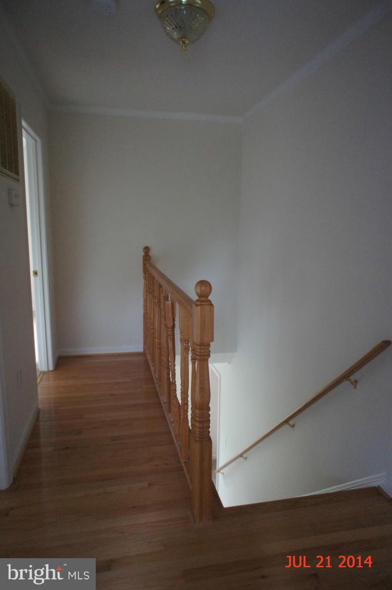 1821 Hatfield Road Huntingtown, MD 20639 - Photo 10 of 18 a view of a hallway with wooden floor