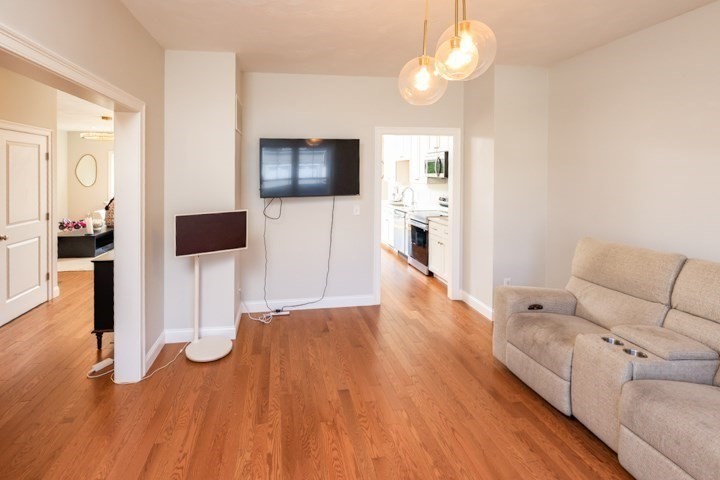 31 Lilac Avenue Bellingham, MA 02019 - Photo 17 of 40 a living room with furniture and a flat screen tv